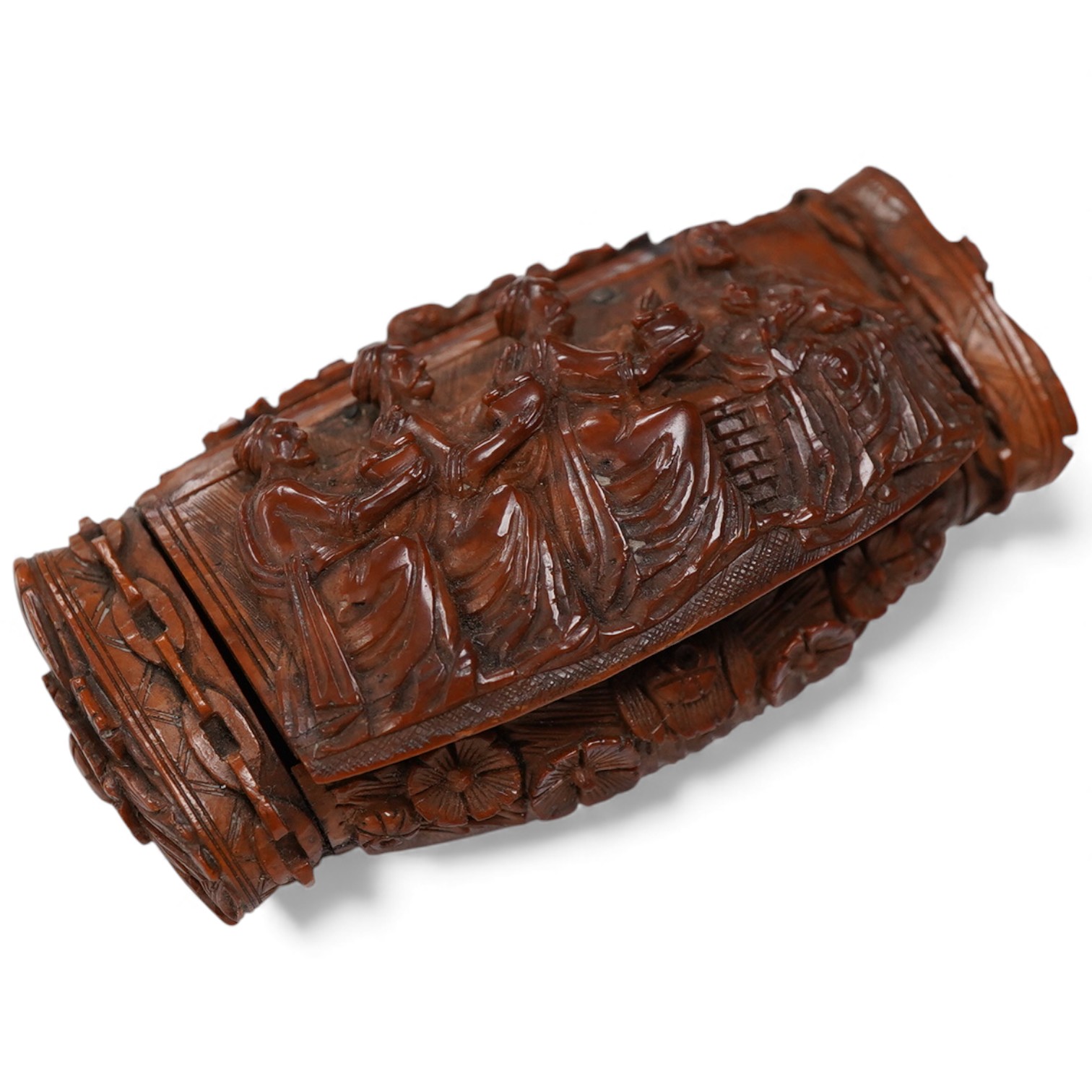 An 18th / 19th century European carved figural coquilla nut snuff box, 8.5cm wide